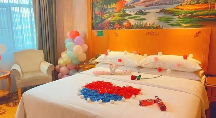 Bed in Vienna Hotel Guangxi Beiliu Passenger Station