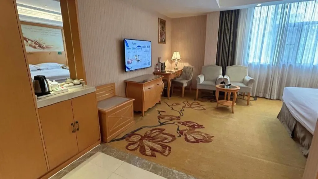 Bed in Vienna Hotel Guangxi Beiliu Passenger Station