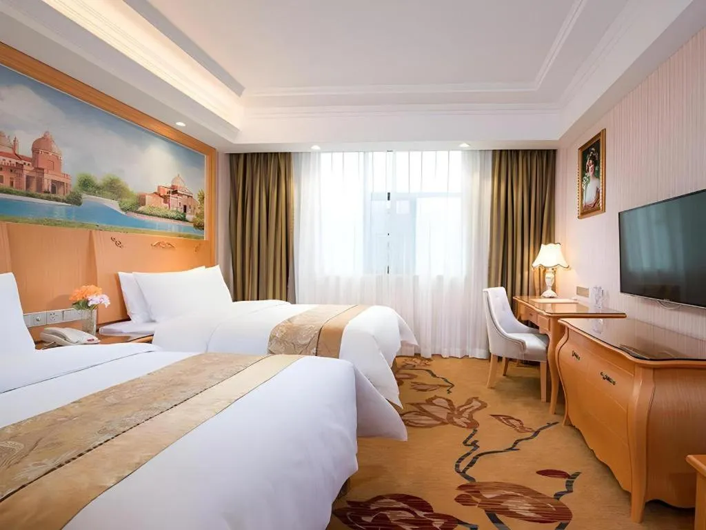 Bed in Vienna Hotel Guangxi Beiliu Passenger Station