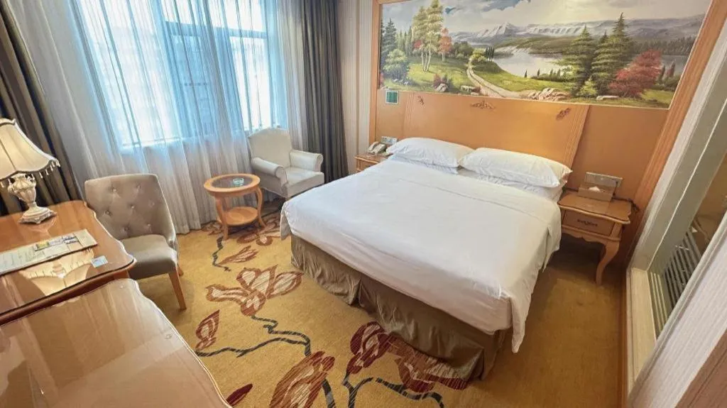 Bed in Vienna Hotel Guangxi Beiliu Passenger Station