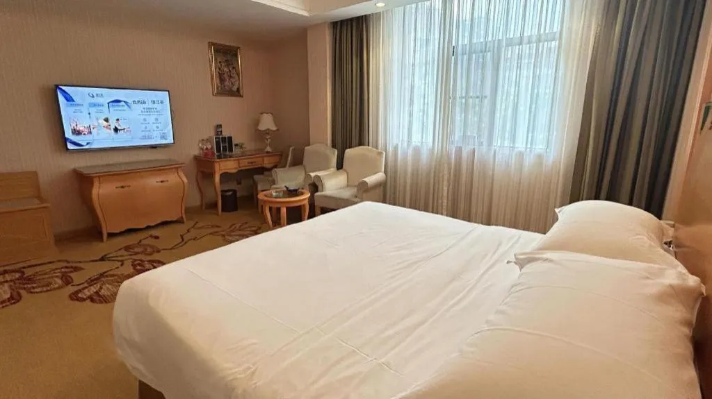 Bed in Vienna Hotel Guangxi Beiliu Passenger Station