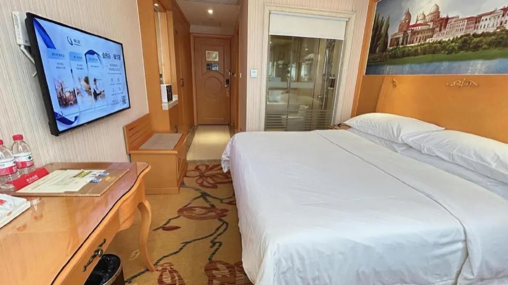 Bed in Vienna Hotel Guangxi Beiliu Passenger Station