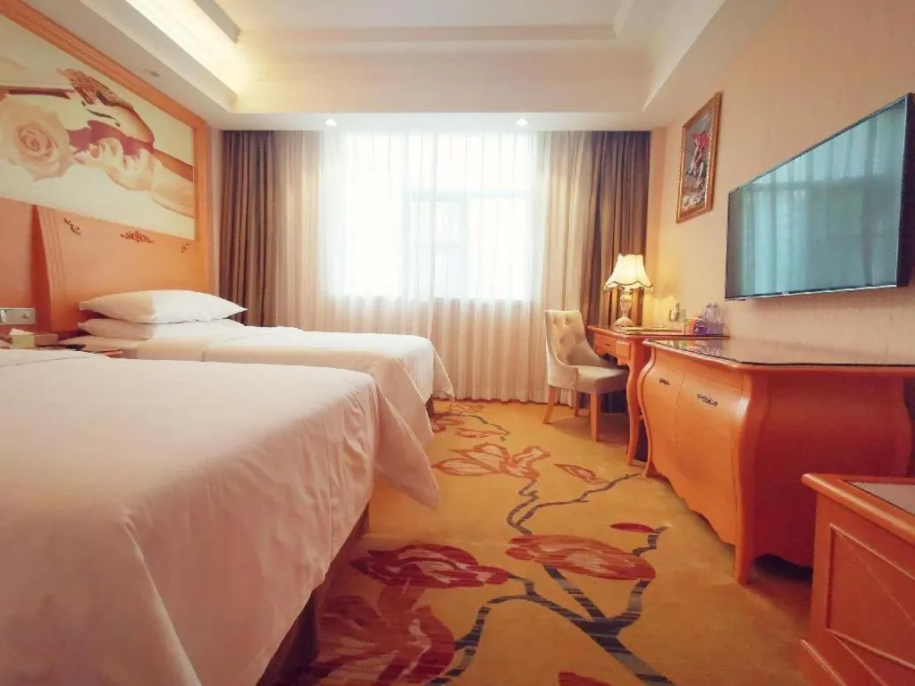 Bed in Vienna Hotel Guangxi Beiliu Passenger Station