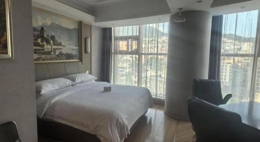 Bed in Vienna Hotel Zhejiang Lishui Qingtian Post Building