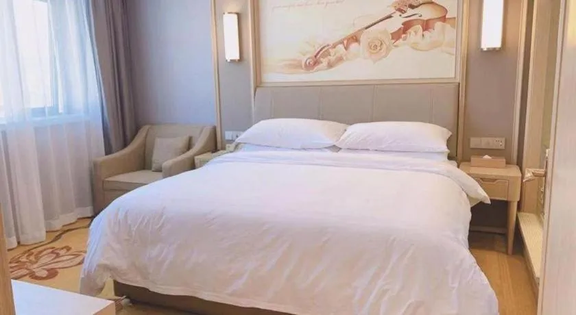 Bed in Vienna Hotel Zhejiang Lishui Qingtian Post Building