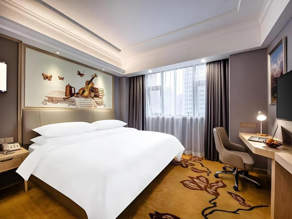 Bed in Vienna Hotel Zhejiang Lishui Qingtian Post Building