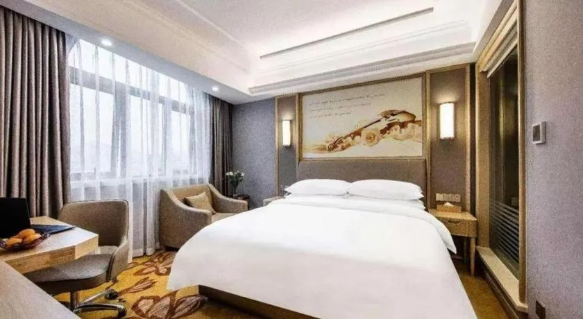 Bed in Vienna Hotel Zhejiang Lishui Qingtian Post Building