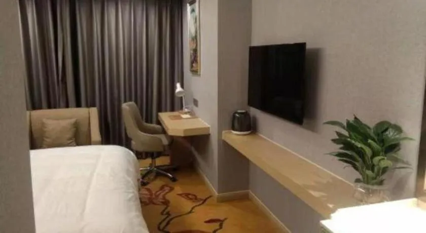 Bed in Vienna Hotel Zhejiang Lishui Qingtian Post Building