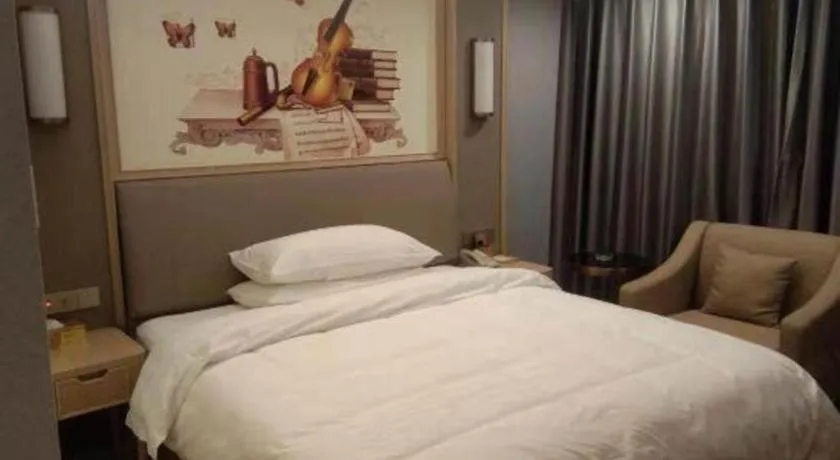 Bed in Vienna Hotel Zhejiang Lishui Qingtian Post Building