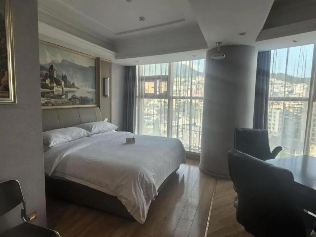 Bed in Vienna Hotel Zhejiang Lishui Qingtian Post Building