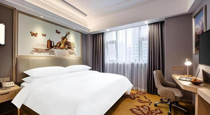 Bed in Vienna Hotel Zhejiang Lishui Qingtian Post Building