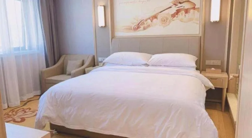 Bed in Vienna Hotel Zhejiang Lishui Qingtian Post Building