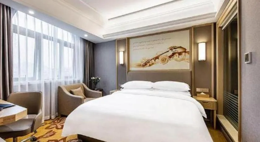 Bed in Vienna Hotel Zhejiang Lishui Qingtian Post Building
