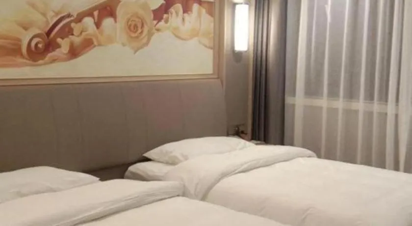Bed in Vienna Hotel Zhejiang Lishui Qingtian Post Building