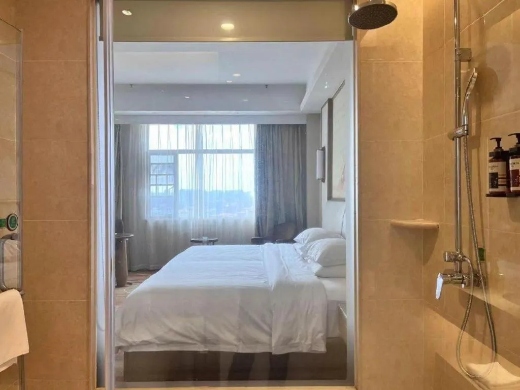 Bed in Vienna Hotel Xinfeng West High-Speed Railway Station