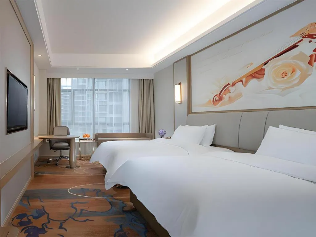 Bed in Vienna Hotel Xinfeng West High-Speed Railway Station