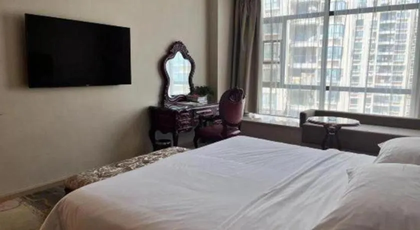 Bed in Vienna Hotel Xinfeng West High-Speed Railway Station