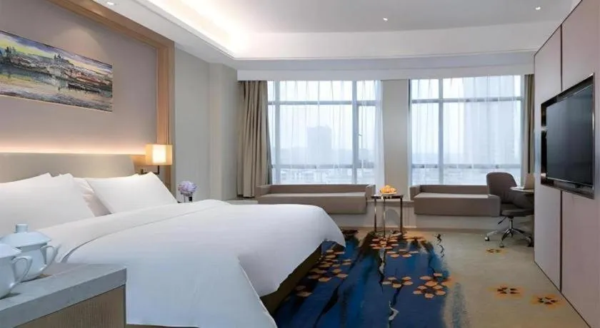 Bed in Vienna Hotel Xinfeng West High-Speed Railway Station