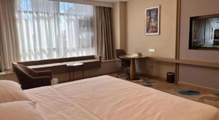 Bed in Vienna Hotel Xinfeng West High-Speed Railway Station