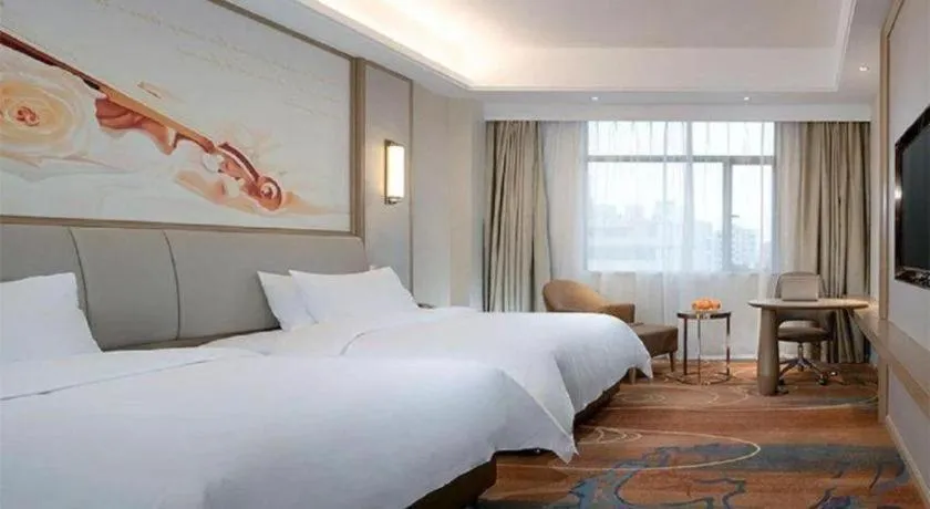 Bed in Vienna Hotel Xinfeng West High-Speed Railway Station