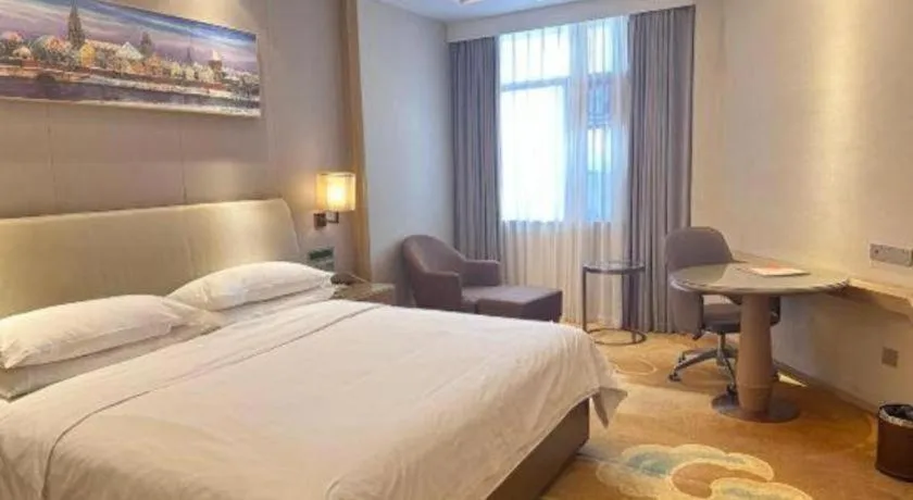 Bed in Vienna Hotel Xinfeng West High-Speed Railway Station