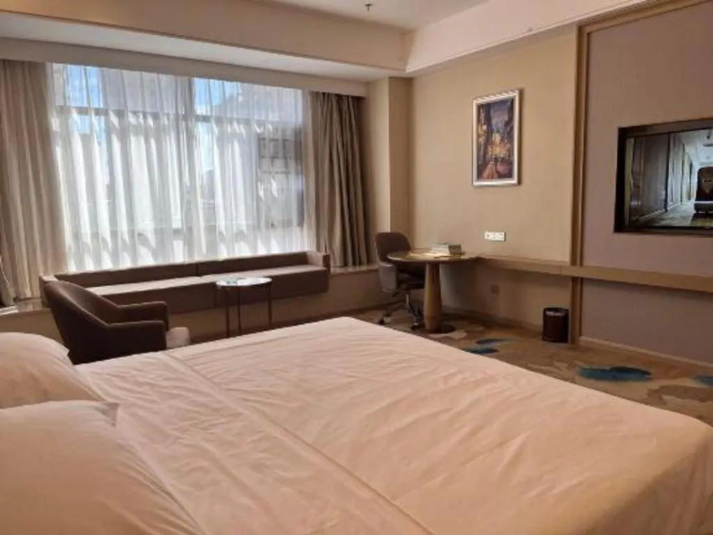 Bed in Vienna Hotel Xinfeng West High-Speed Railway Station