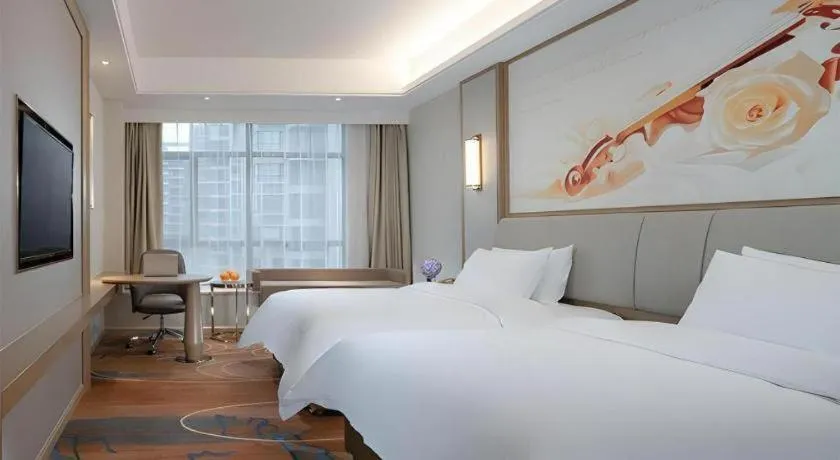 Bed in Vienna Hotel Xinfeng West High-Speed Railway Station