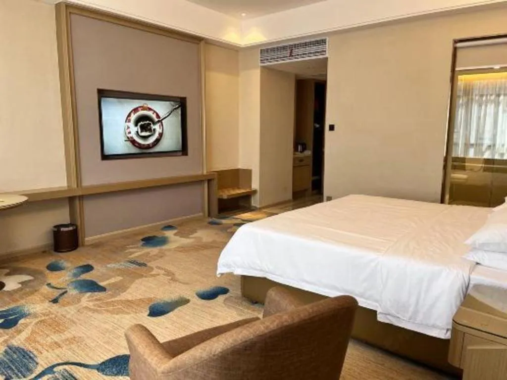 Bed in Vienna Hotel Xinfeng West High-Speed Railway Station