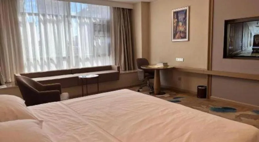 Bed in Vienna Hotel Xinfeng West High-Speed Railway Station