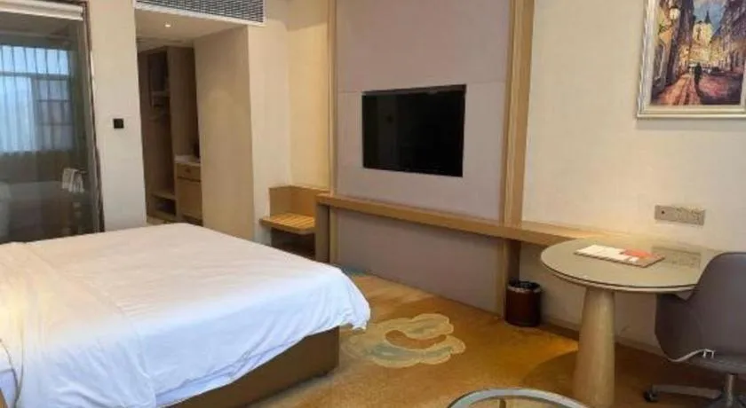 Bed in Vienna Hotel Xinfeng West High-Speed Railway Station