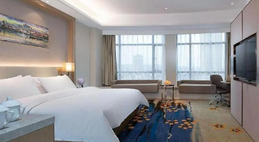 Bed in Vienna Hotel Xinfeng West High-Speed Railway Station