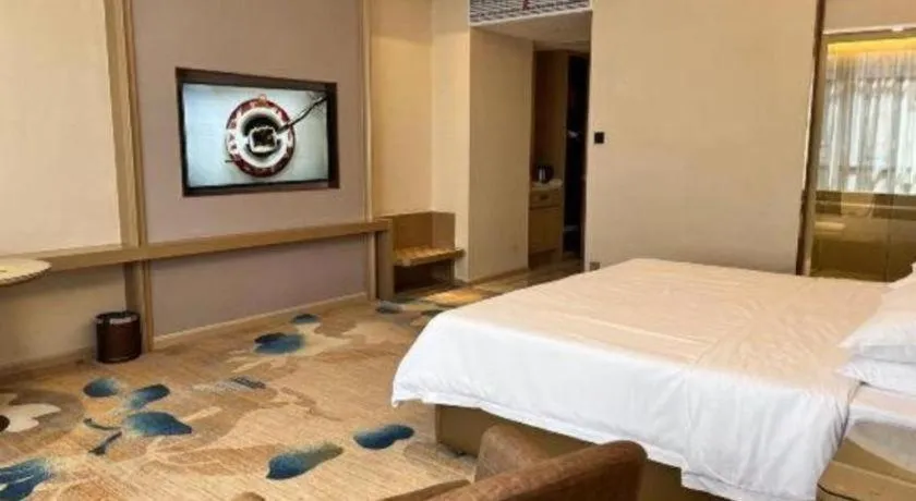 Bed in Vienna Hotel Xinfeng West High-Speed Railway Station