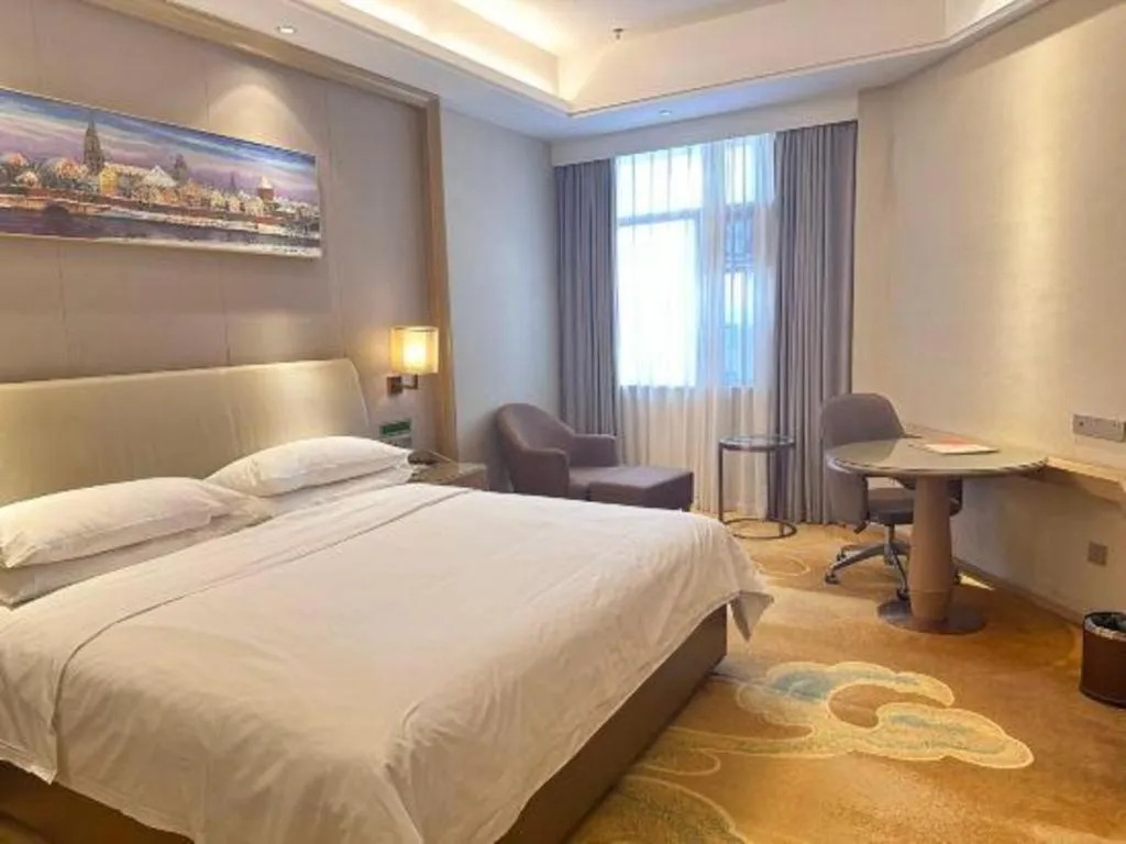 Bed in Vienna Hotel Xinfeng West High-Speed Railway Station