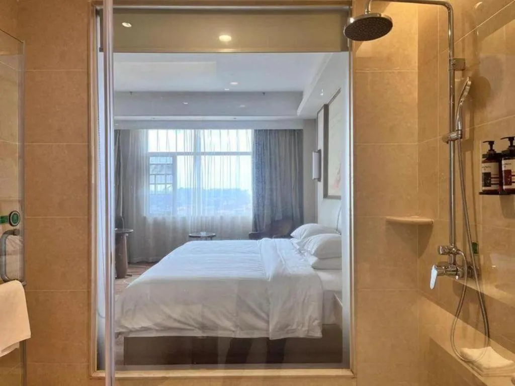 Bed in Vienna Hotel Xinfeng West High-Speed Railway Station