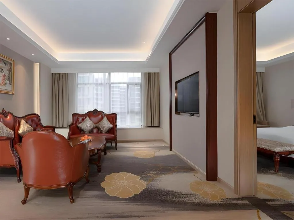 Bed in Vienna Hotel Xinfeng West High-Speed Railway Station