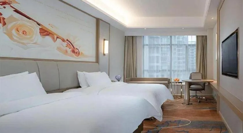 Bed in Vienna Hotel Xinfeng West High-Speed Railway Station