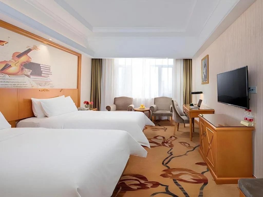 Bed in Vienna Hotel Shanxi Datong High-Speed Railway Station Wanda Plaza