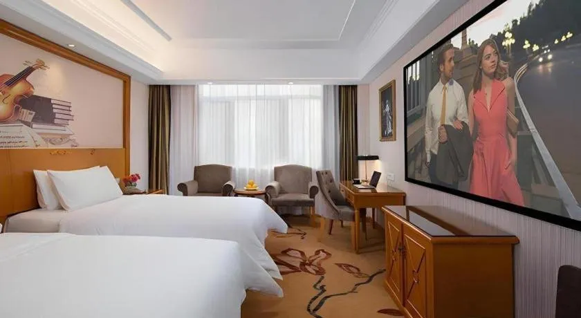 Bed in Vienna Hotel Shanxi Datong High-Speed Railway Station Wanda Plaza