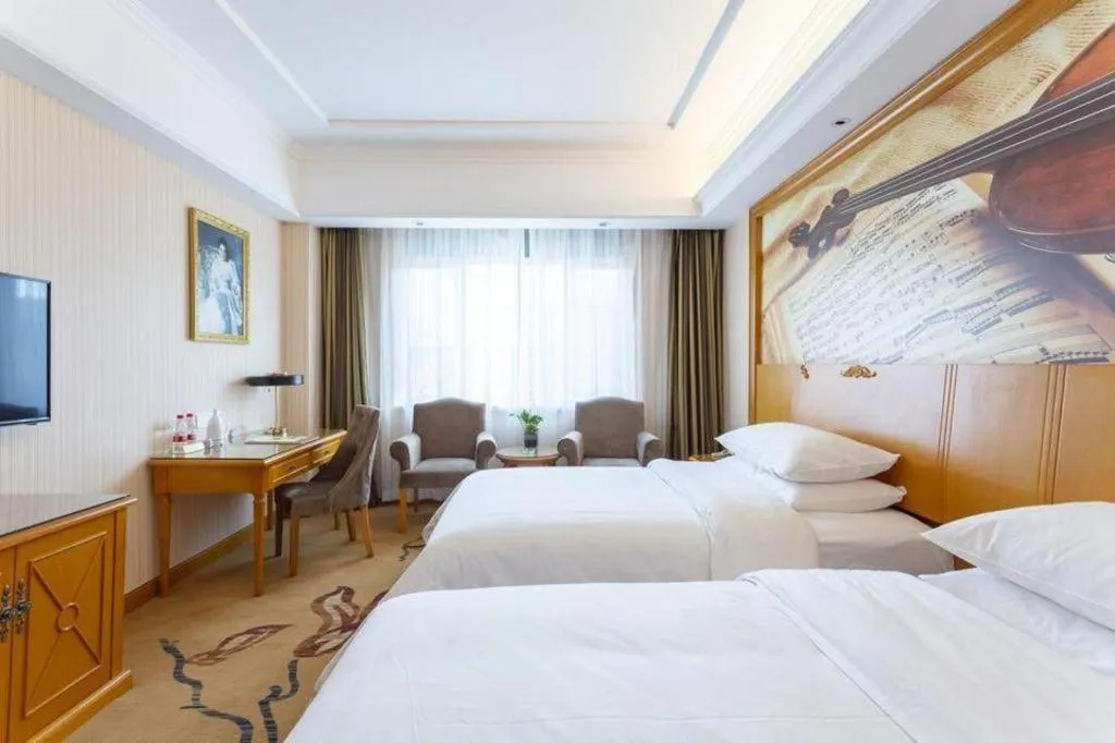 Bed in Vienna Hotel Shanxi Datong High-Speed Railway Station Wanda Plaza