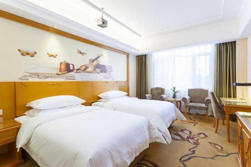 Bed in Vienna Hotel Shanxi Datong High-Speed Railway Station Wanda Plaza