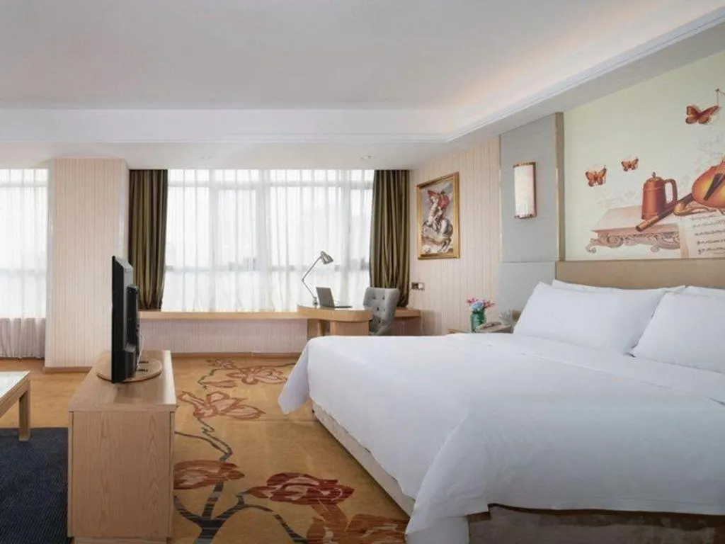 Bed in Vienna Hotel Shandong Qingzhou Ancient City