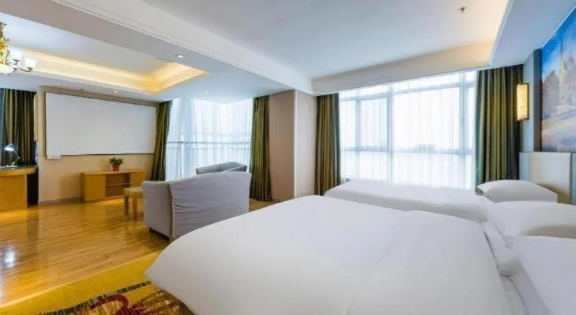 Bed in Vienna Hotel Shandong Qingzhou Ancient City