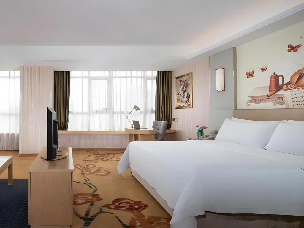 Bed in Vienna Hotel Shandong Qingzhou Ancient City