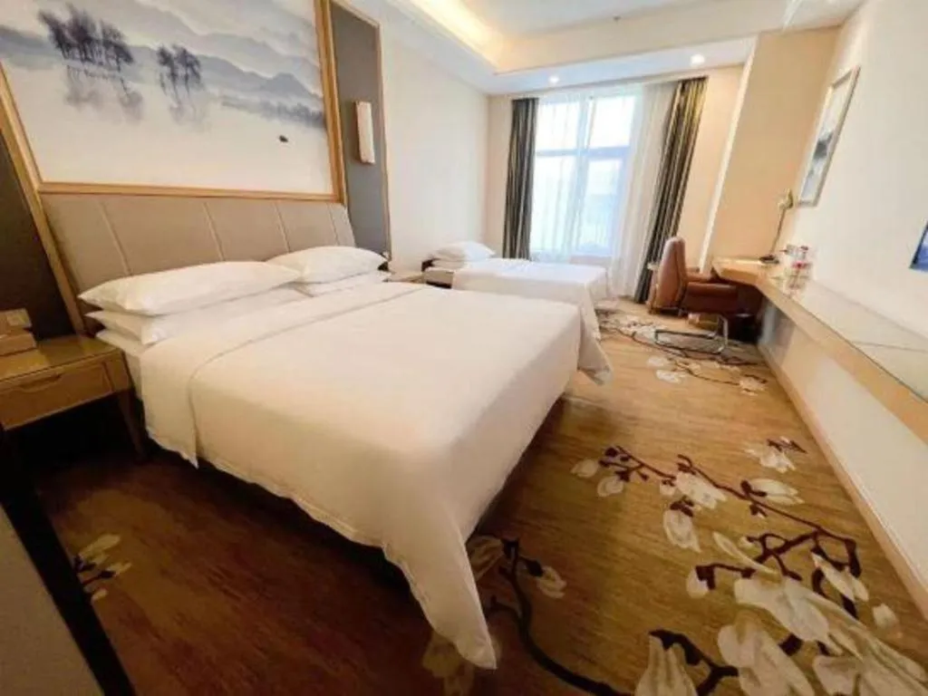 Bed in Vienna Hotel Tianjin Binhai International Airport Free Trade Zone