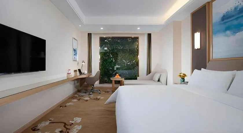 Bed in Vienna Hotel Tianjin Binhai International Airport Free Trade Zone