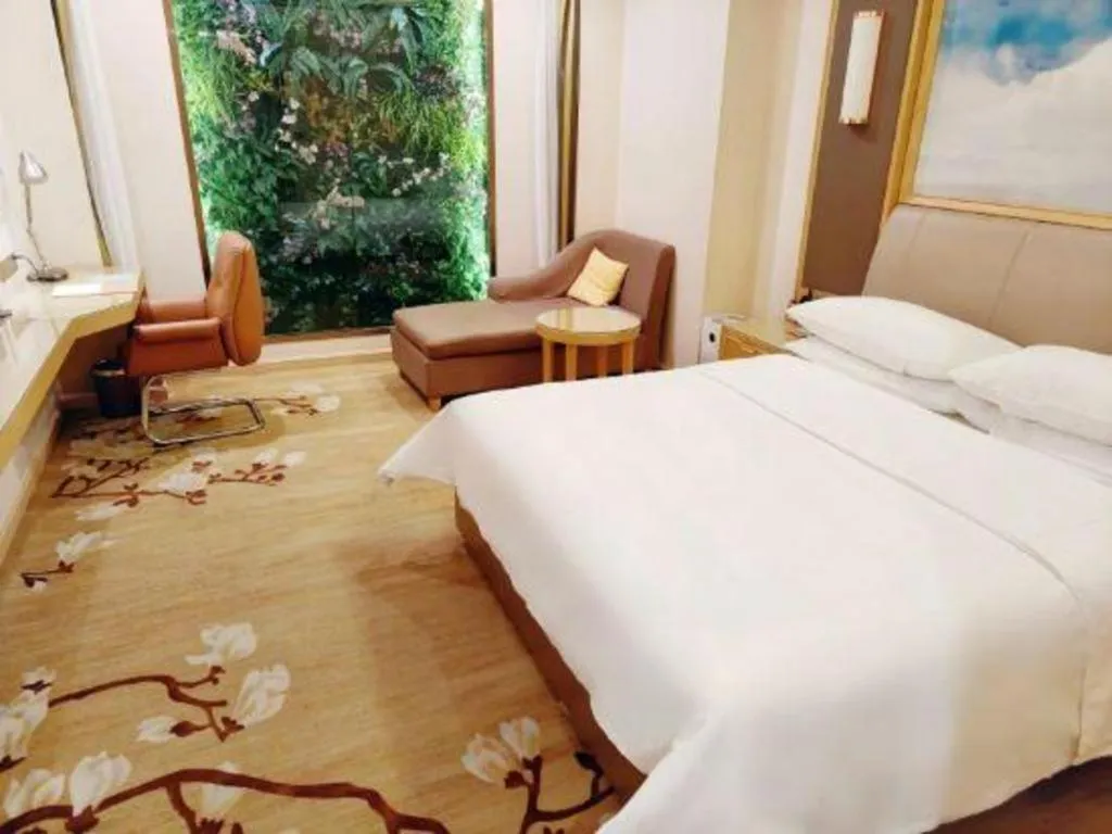 Bed in Vienna Hotel Tianjin Binhai International Airport Free Trade Zone