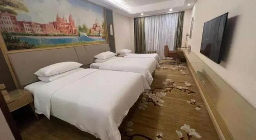 Bed in Vienna Hotel Tianjin Binhai International Airport Free Trade Zone
