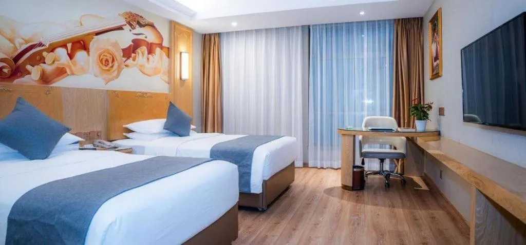 Bed in Vienna Hotel Chongqing Jiefangbei Hongyadong