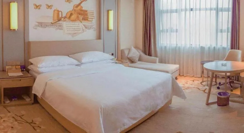 Bed in Venus International Hotel Guangdong Meizhou Fengshun Huamao Hot-Spring