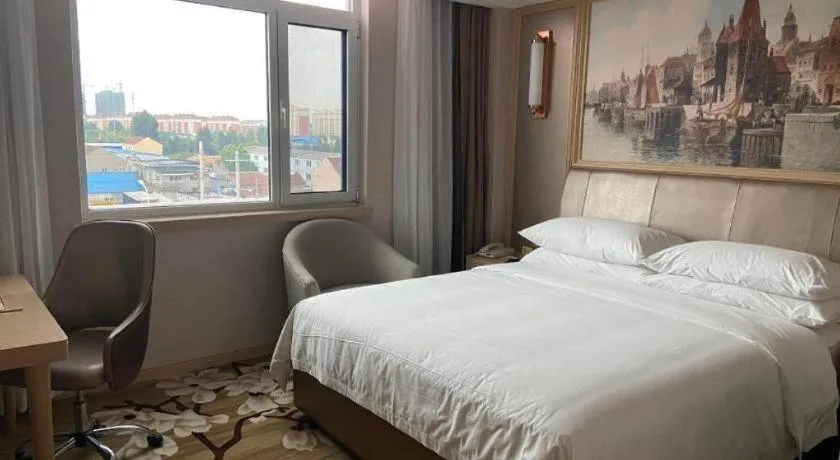 Bed in Vienna Hotel Shandong Qingdao Jiaodong International Airport Hai'er Avenue